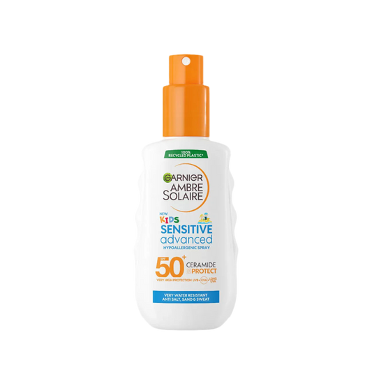 A bottle of Garnier Ambre Solaire Kids SPF 50+ Sun Spray with a white and orange design, indicating sensitive skin protection.