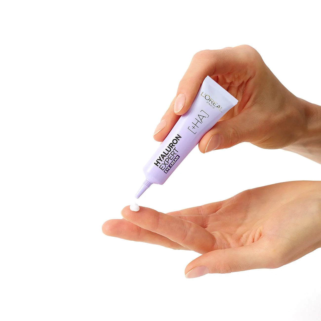 Hand holding a tube of hyaluronic acid gel with a white background