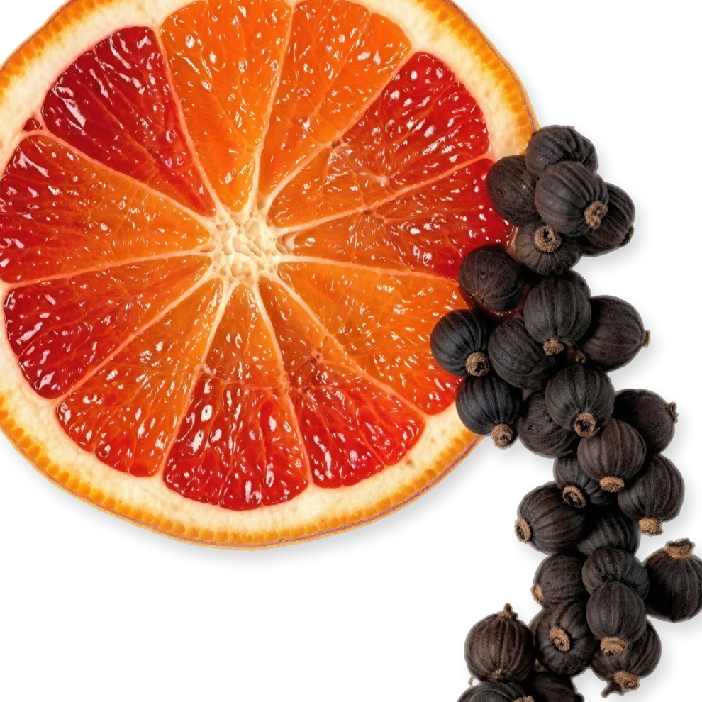 Sliced blood orange with black currants on a white background