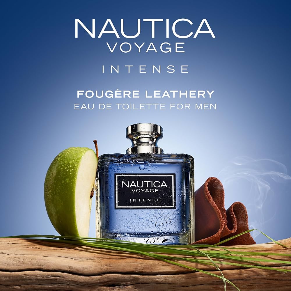 Nautica Voyage Intense perfume bottle with an apple and brown cloth on a wooden surface against a blue background