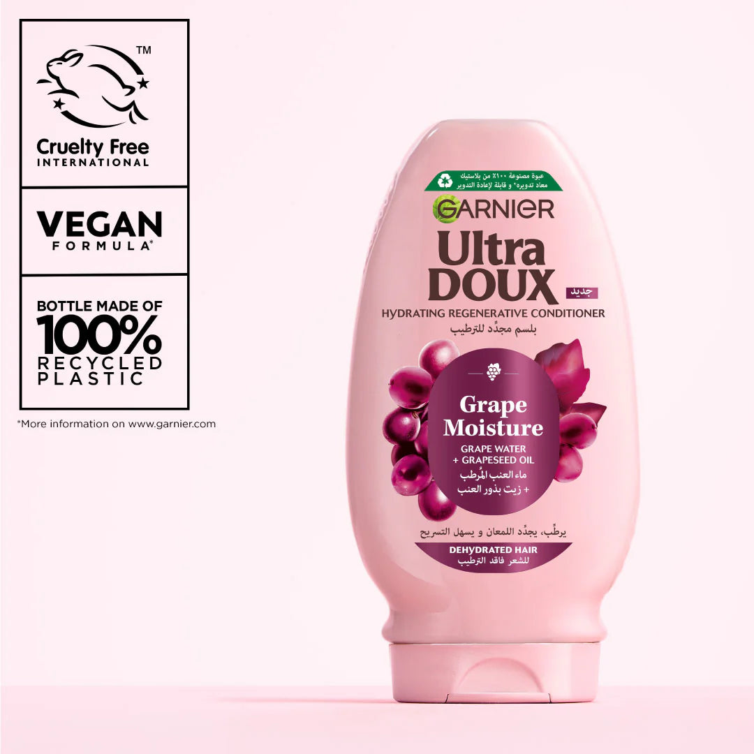 Garnier Ultra Doux Grape Moisture conditioner bottle with branding and sustainability information on a white background