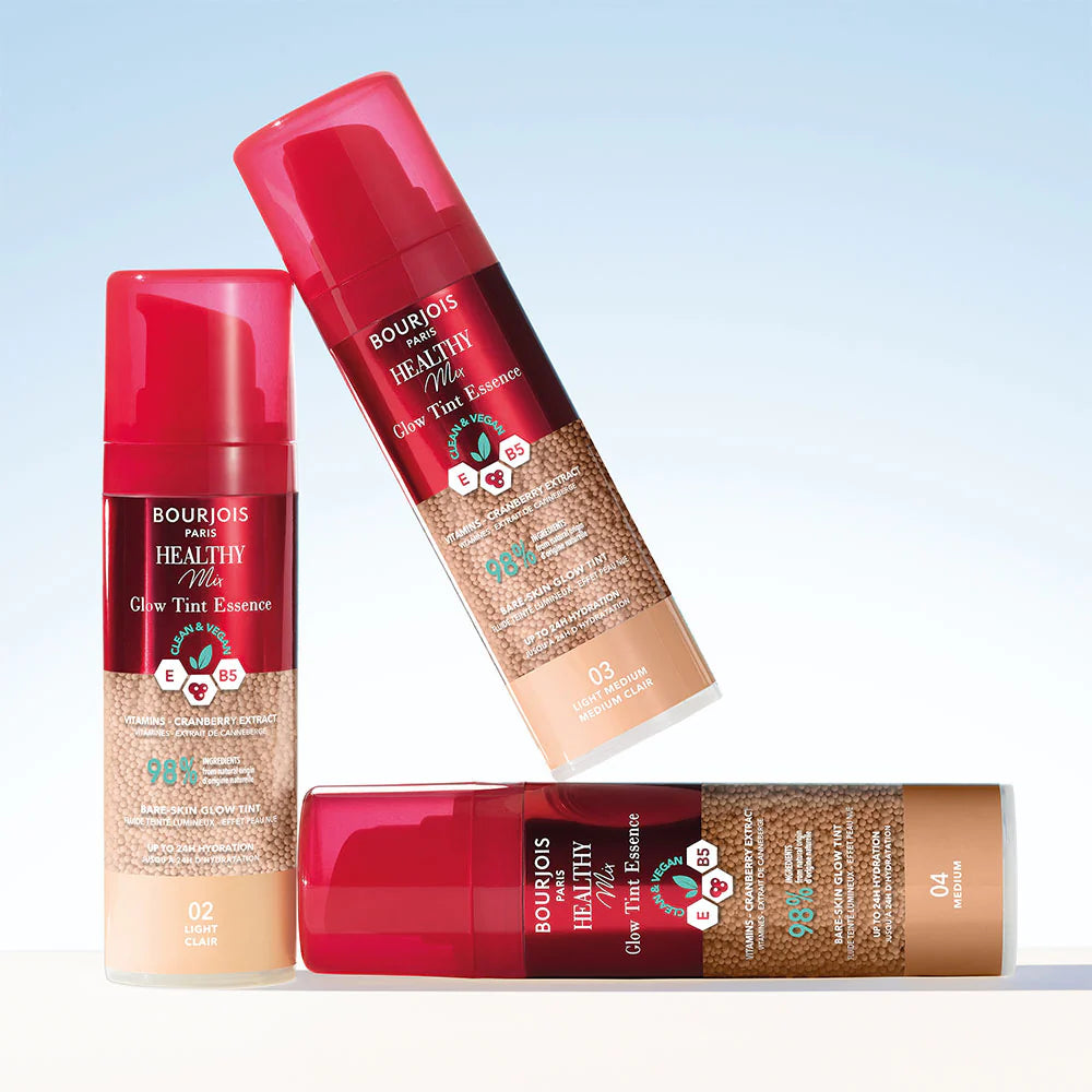 Three Bourjois Healthy Mix tanning products on a light blue background