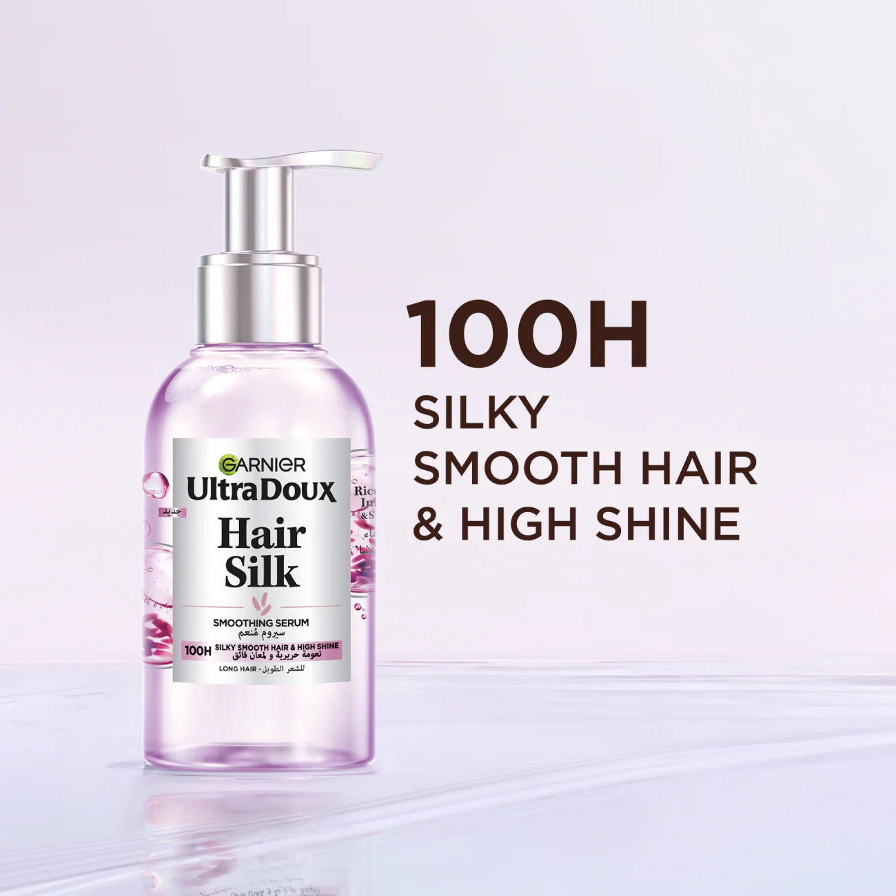 Garnier UltraDoux Hair Silk serum bottle with text on a light purple background