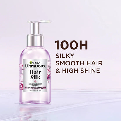 Garnier UltraDoux Hair Silk serum bottle with text on a light purple background