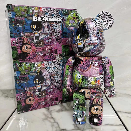 Colorful BE@RBRICK toy figure with matching box on a marble surface