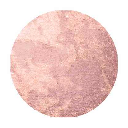 Round blush swatch with a pink-to-purple gradient on a white background