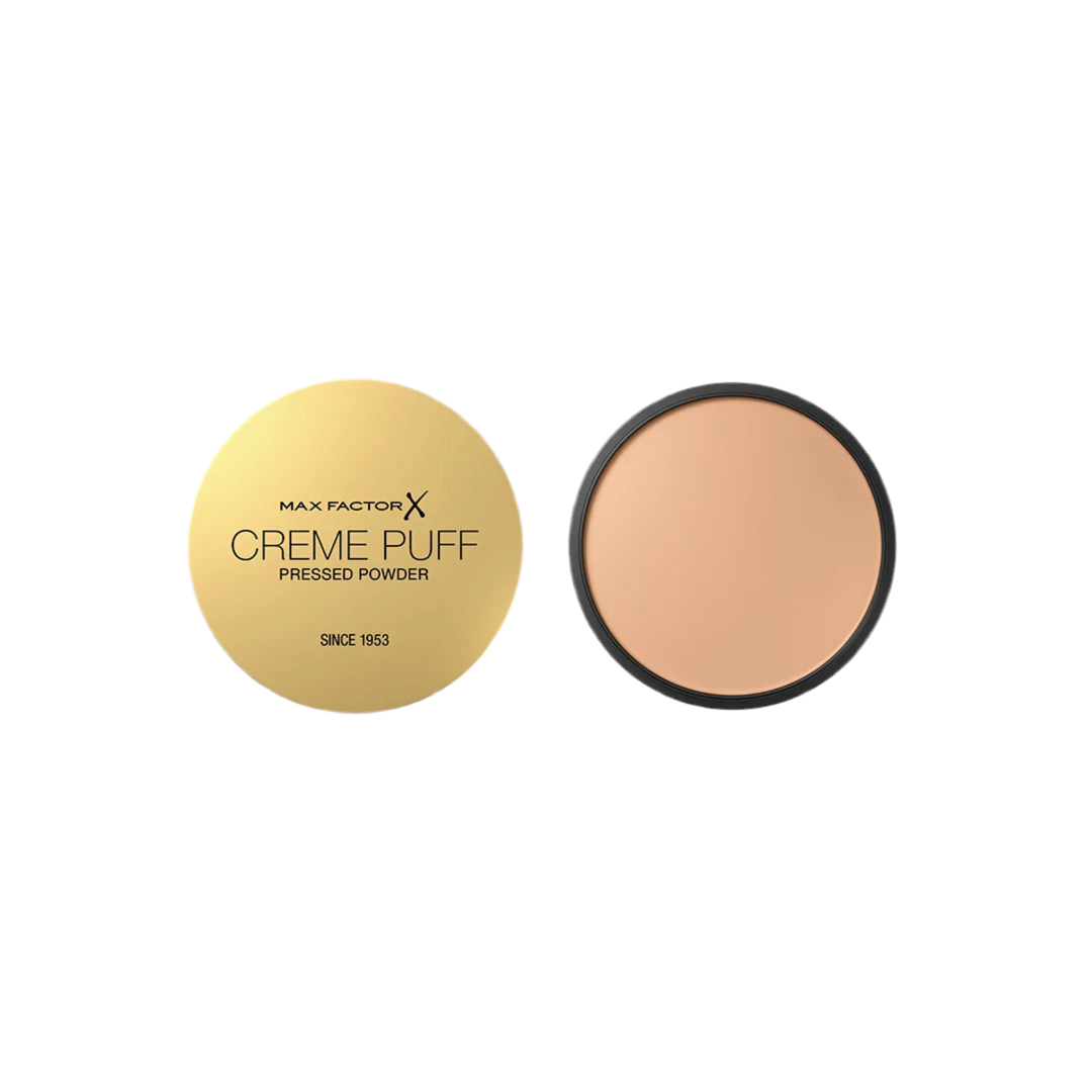 Max Factor Creme Puff pressed powder with gold case on a white background