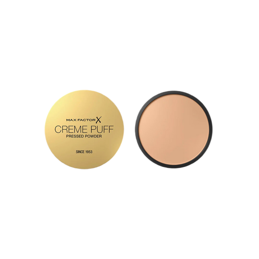 Max Factor Creme Puff pressed powder with gold case on a white background