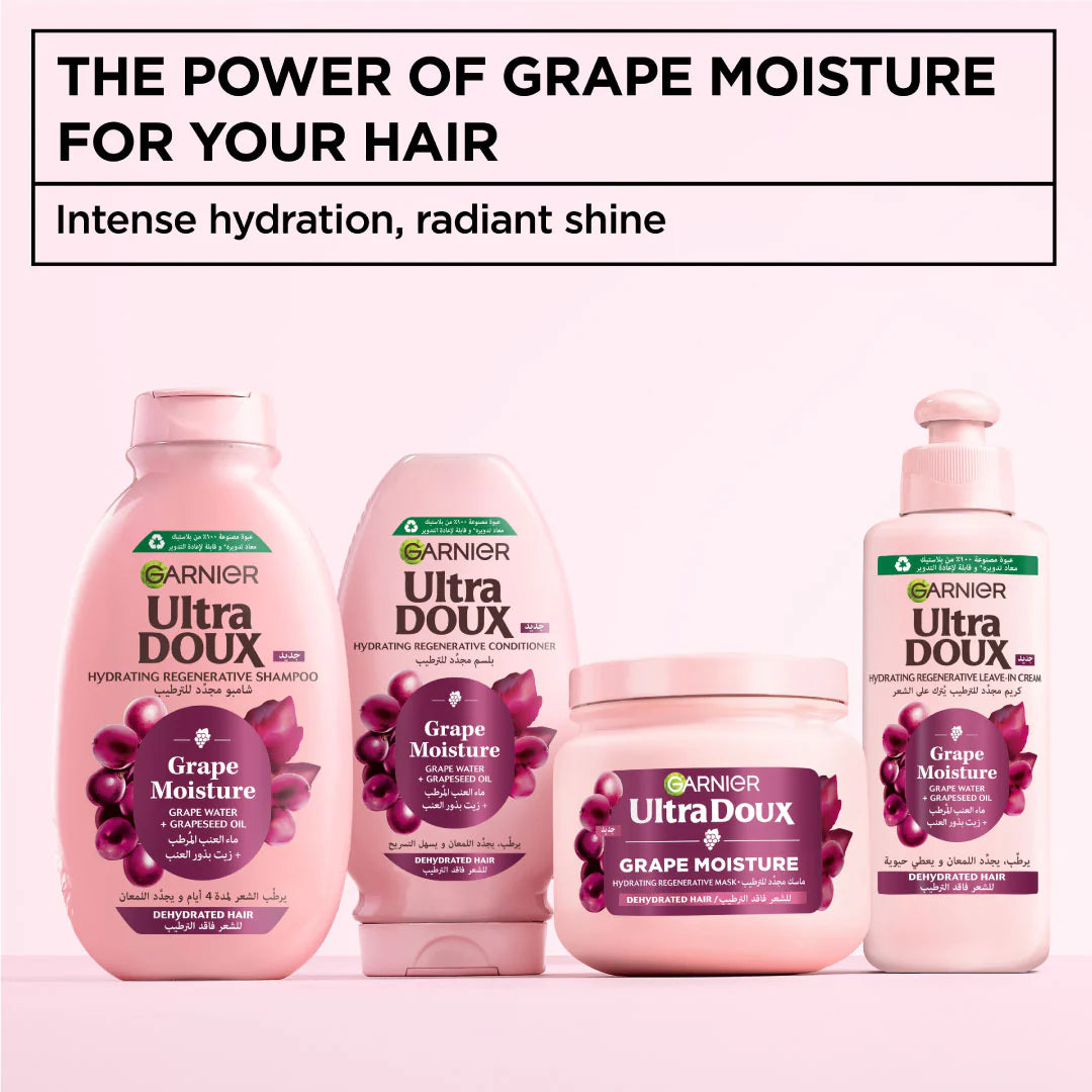 Garnier Ultra Doux Grape Moisture hair care products on a pink background