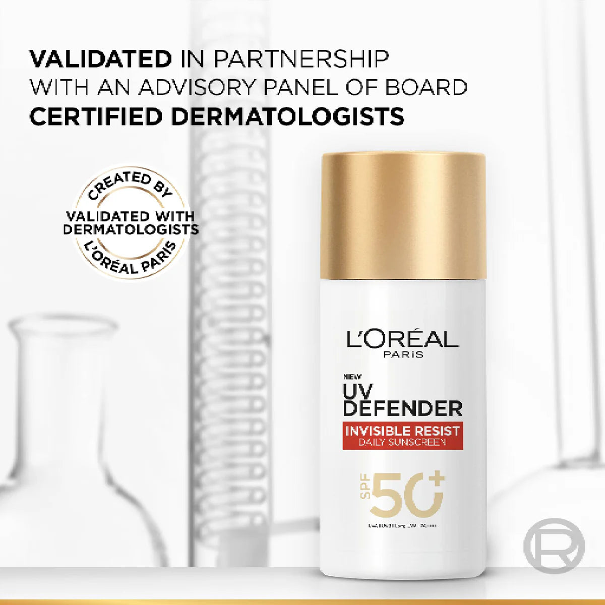 L'Oreal UV Defender sunscreen bottle with text about dermatologist validation on a white background