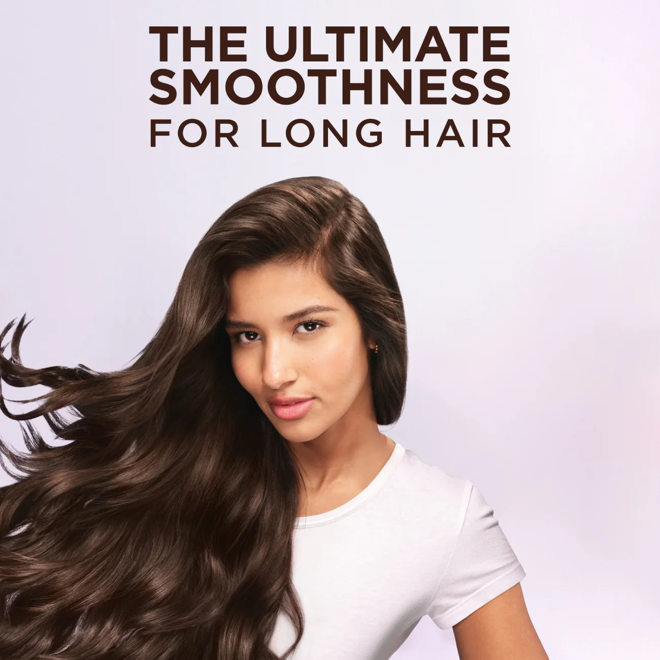Woman with long, wavy hair against a light background with text 'The Ultimate Smoothness For Long Hair'.