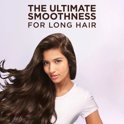 Woman with long, wavy hair against a light background with text 'The Ultimate Smoothness For Long Hair'.