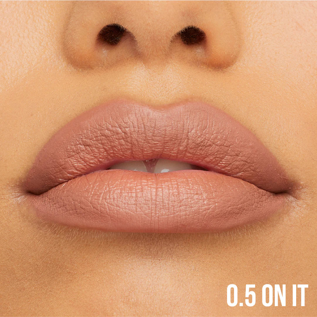 Close-up of a person's lips with a neutral color swatch labeled '0.5 ON IT'.