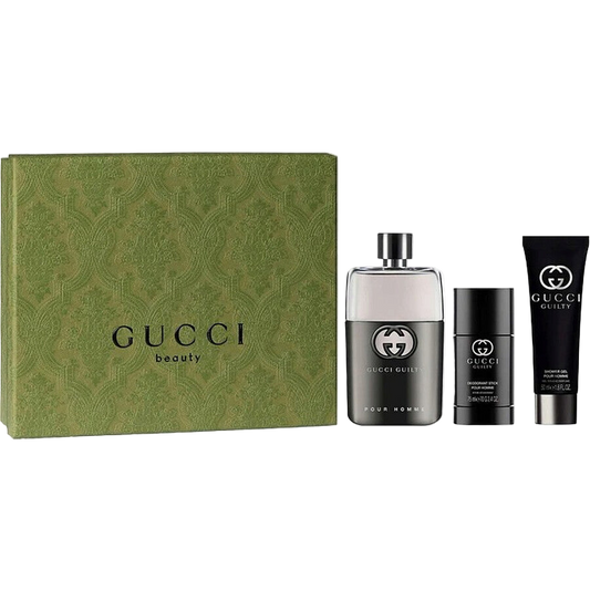 Gucci Guilty beauty product set including a perfume bottle, a stick, and a tube on a white background