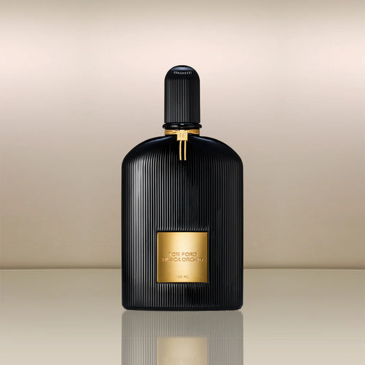 Black and gold Tom Ford Black Orchid perfume bottle on a beige background
