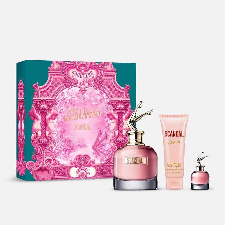 Jean Paul Gaultier Scandal perfume set with pink bottle, box, and body lotion on a white background
