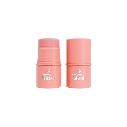 Two pink cylindrical cosmetic stick containers labeled 'creamy Blush' for face blush  on a plain white background.