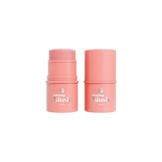 Two pink cylindrical cosmetic stick containers labeled 'creamy Blush' for face blush  on a plain white background.