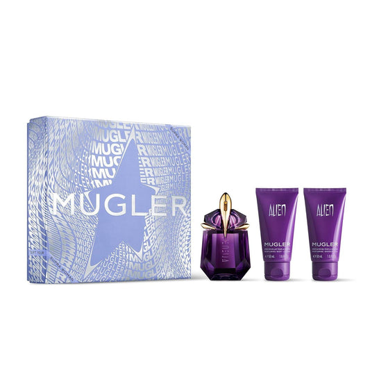 Mugler Alien fragrance gift set featuring a purple faceted perfume bottle with a gold cap, two purple body care tubes, and a light blue patterned gift box on a white background.