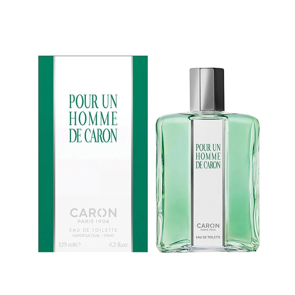Caron Pour Un Homme De Caron Eau De Toilette bottle with its retail box, featuring a light green liquid and green and white packaging on a white background.