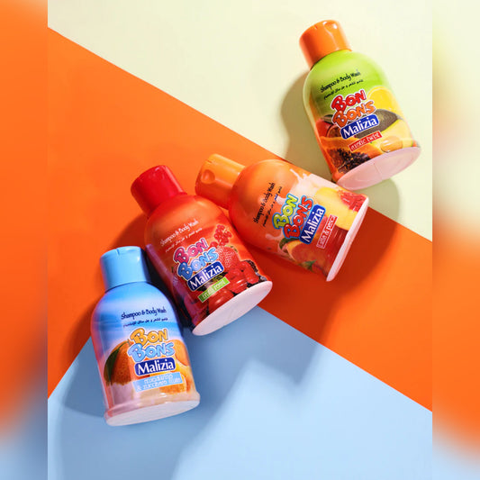 Four bottles of Bom Bom Malizia shampoo and body wash on a colorful geometric background