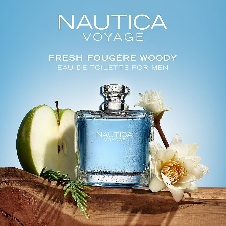 Nautica Voyage perfume bottle with apple and flowers on a wooden surface