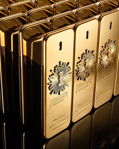 Gold perfume bottles of Paco Rabanne 1 Million with a prominent brand logo on a reflective surface