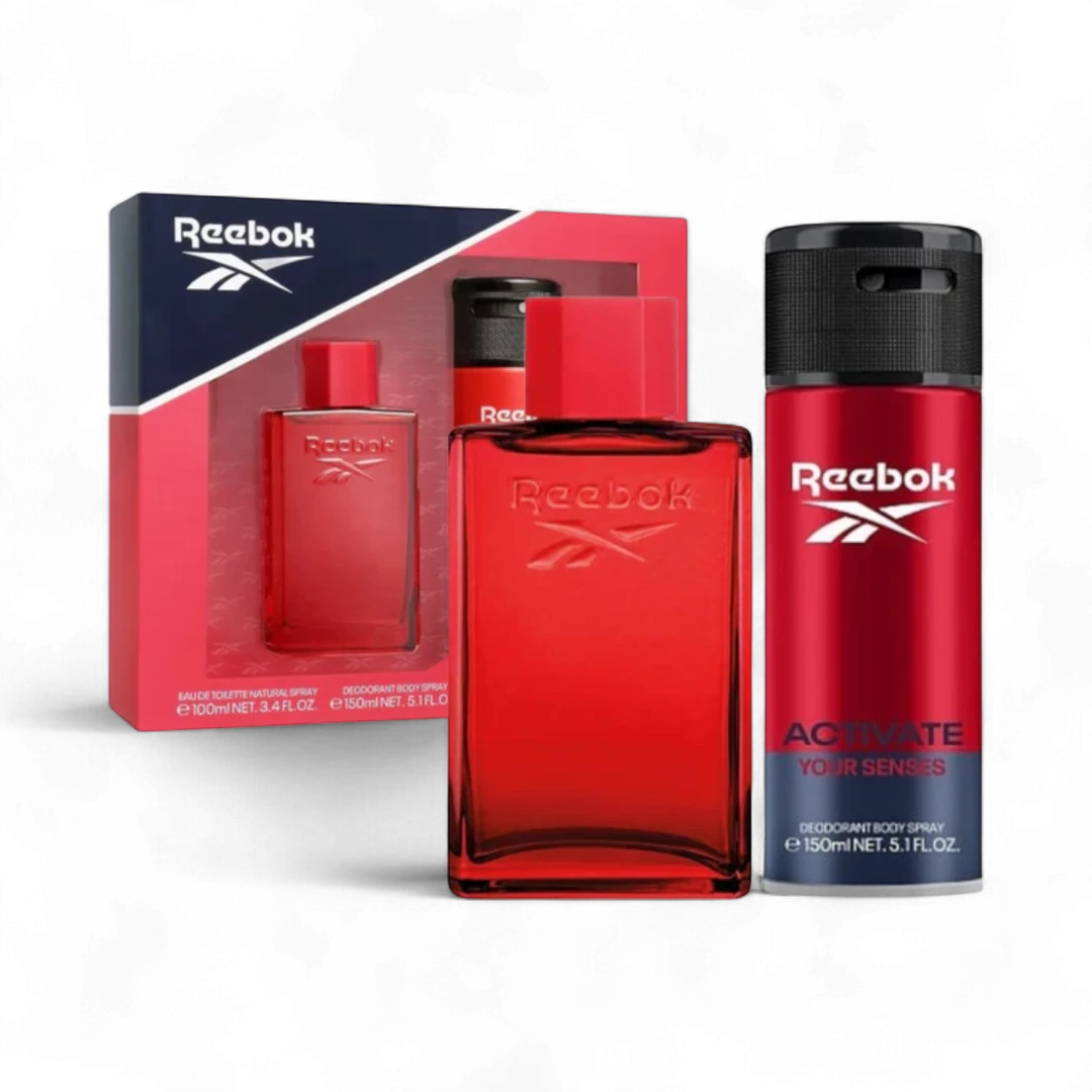 Reebok men's fragrance set with red bottle eau de toilette and bottle of deodorant spray and black cap on a white background