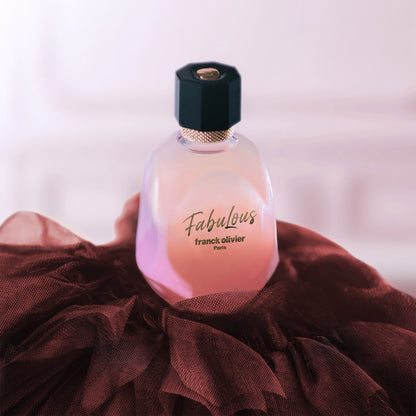 Perfume bottle labeled 'Fabulous' by franck olivier on a soft pink background