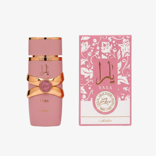Pink perfume bottle branded Lattafa Yara Elixir with gold accents and matching box on a white background
